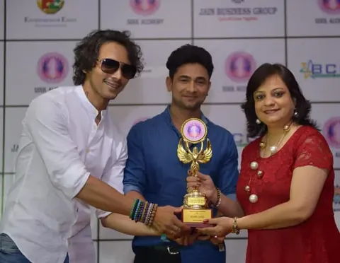 Dr. Riddhe Sshilpi – Honoured at a business awards evening, Trophy presentation on stage