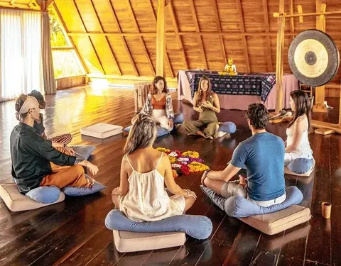 Participants seated in a circle for a family constellation group session