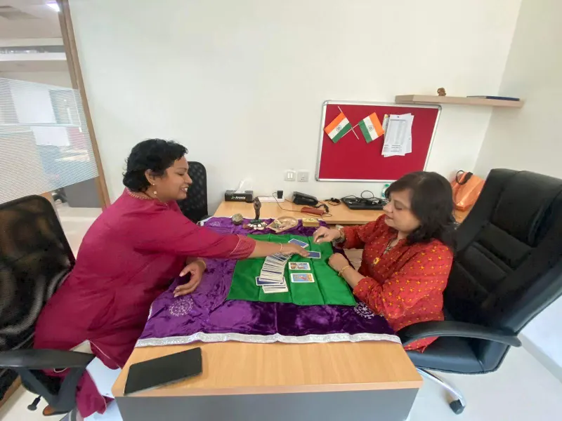 Dr. Riddhe Sshilpi giving a tarot reading to an employee during a corporate session