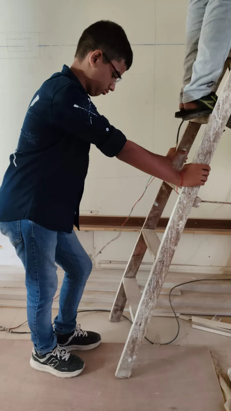 Installation team fixing a Vastu correction in a South Mumbai home